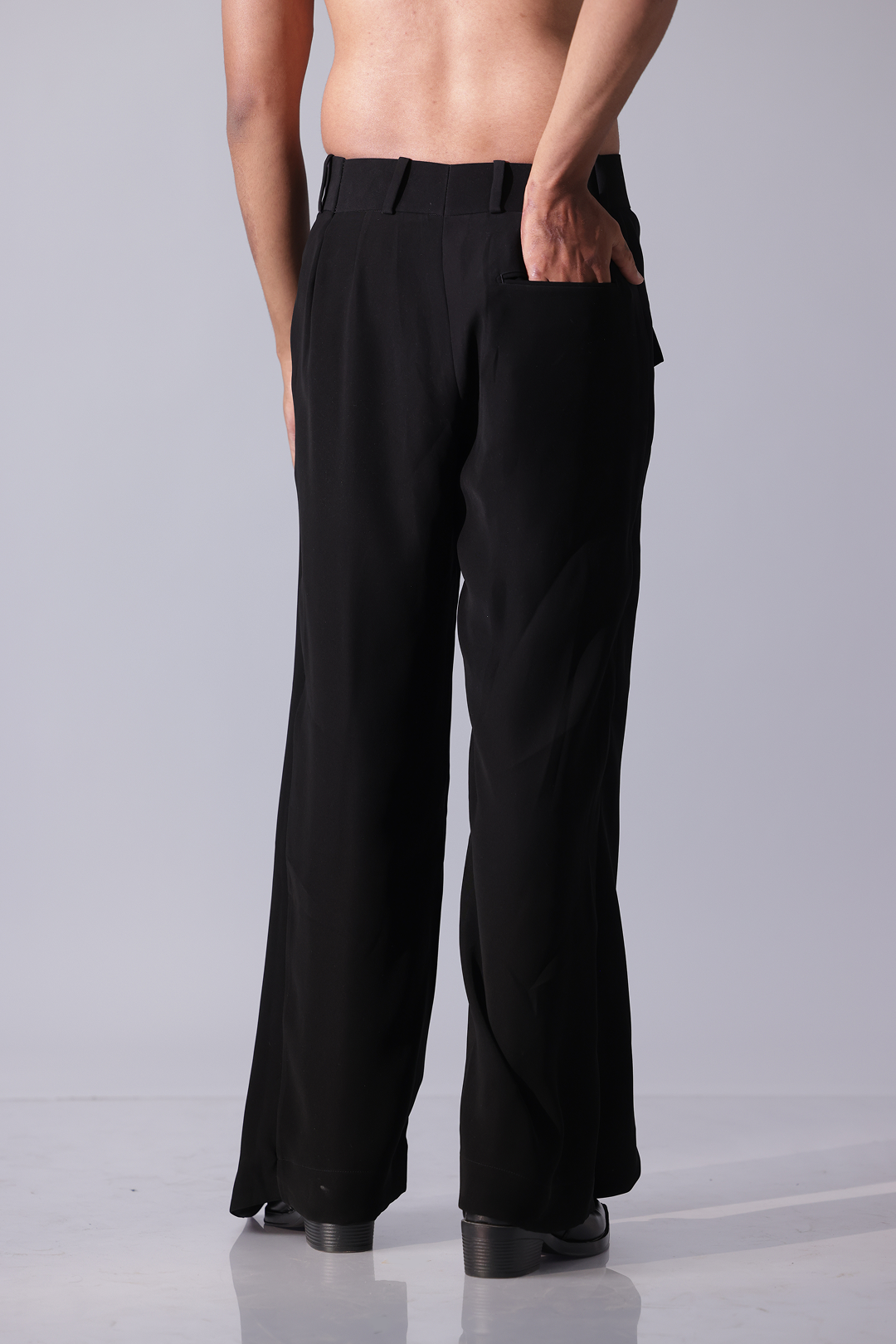 High-waisted black flared trousers