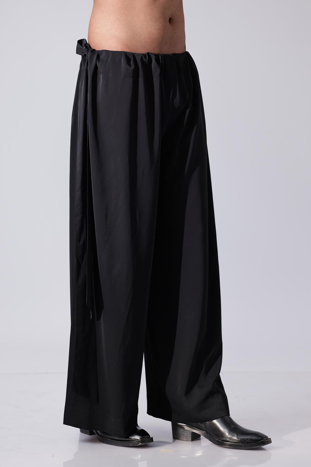 PANT - Black pants with broad flap detailing on botom hem